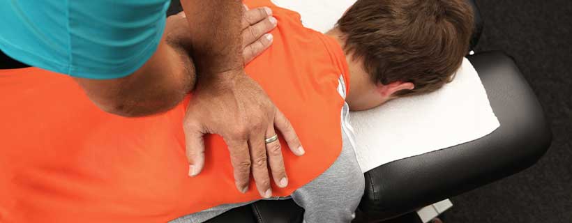 patient receiving drop table chiropractic in Colville